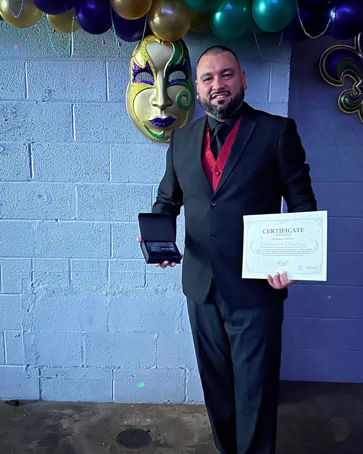 Honoree with certificate at the Crescent City Gala